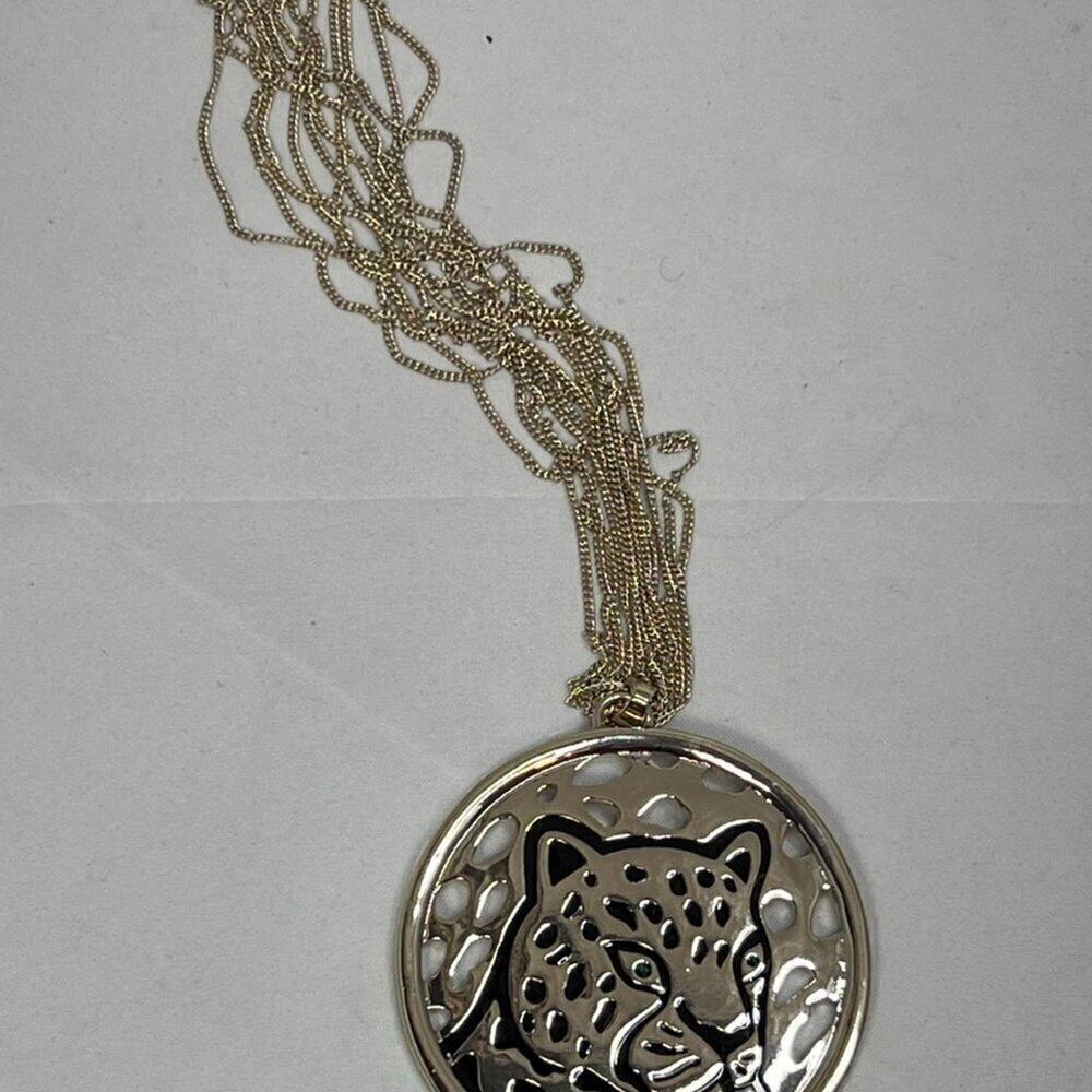 Ballet gold toned necklace with giant leopard pendant.